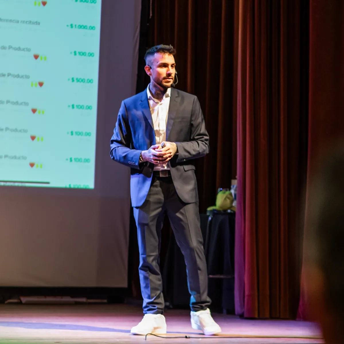 A diverse group of professional coaches collaborating in a modern, sunlit workspace, with digital devices and notebooks, symbolizing community and innovation in coaching. The background features large windows and greenery, conveying openness and growth.