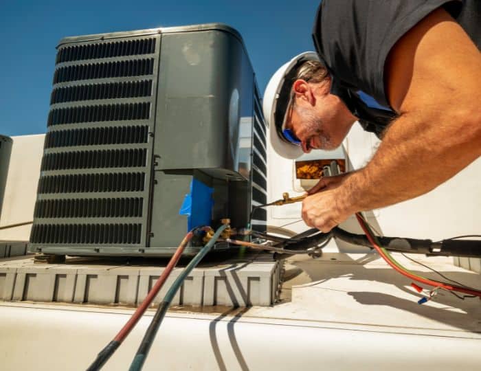 Industrial warehouse aisle with stacked valves and pipe fittings