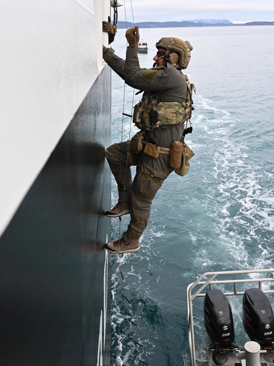 soldier climbing onto a boat