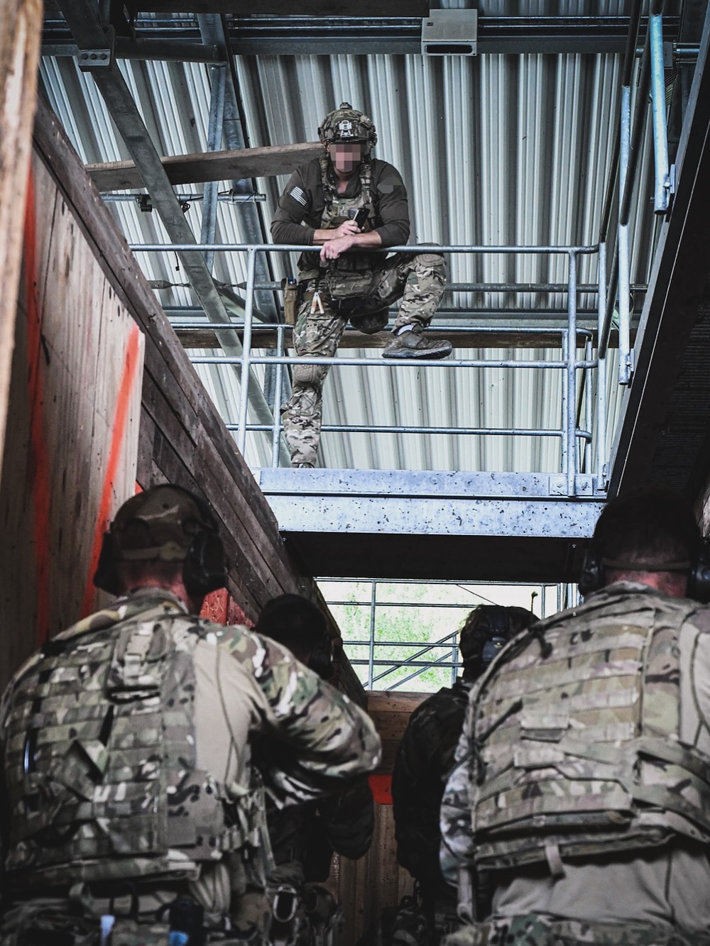 solider leaning on railing