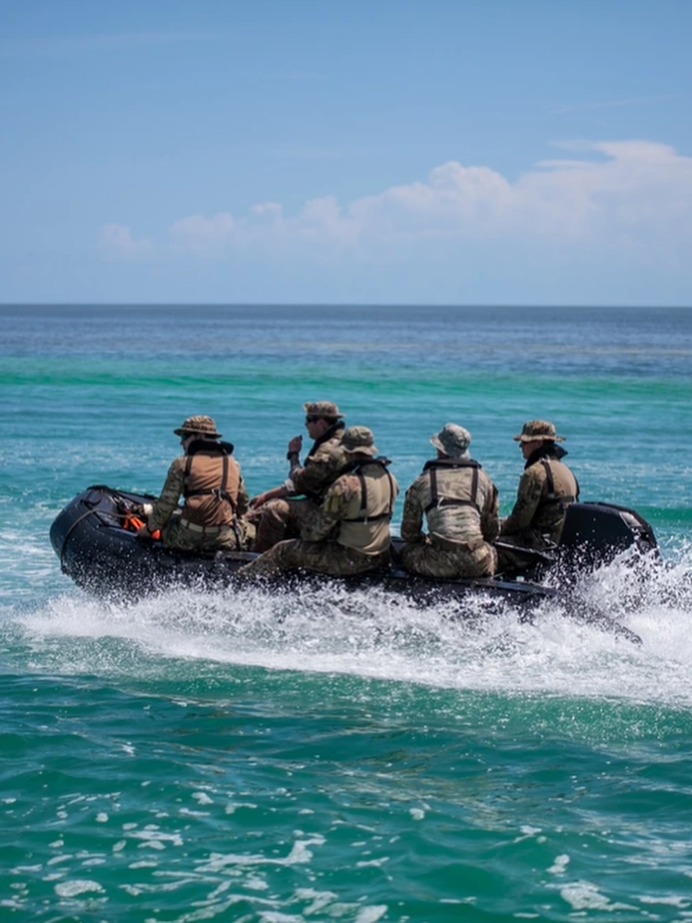 Soldiers in a boat on the water