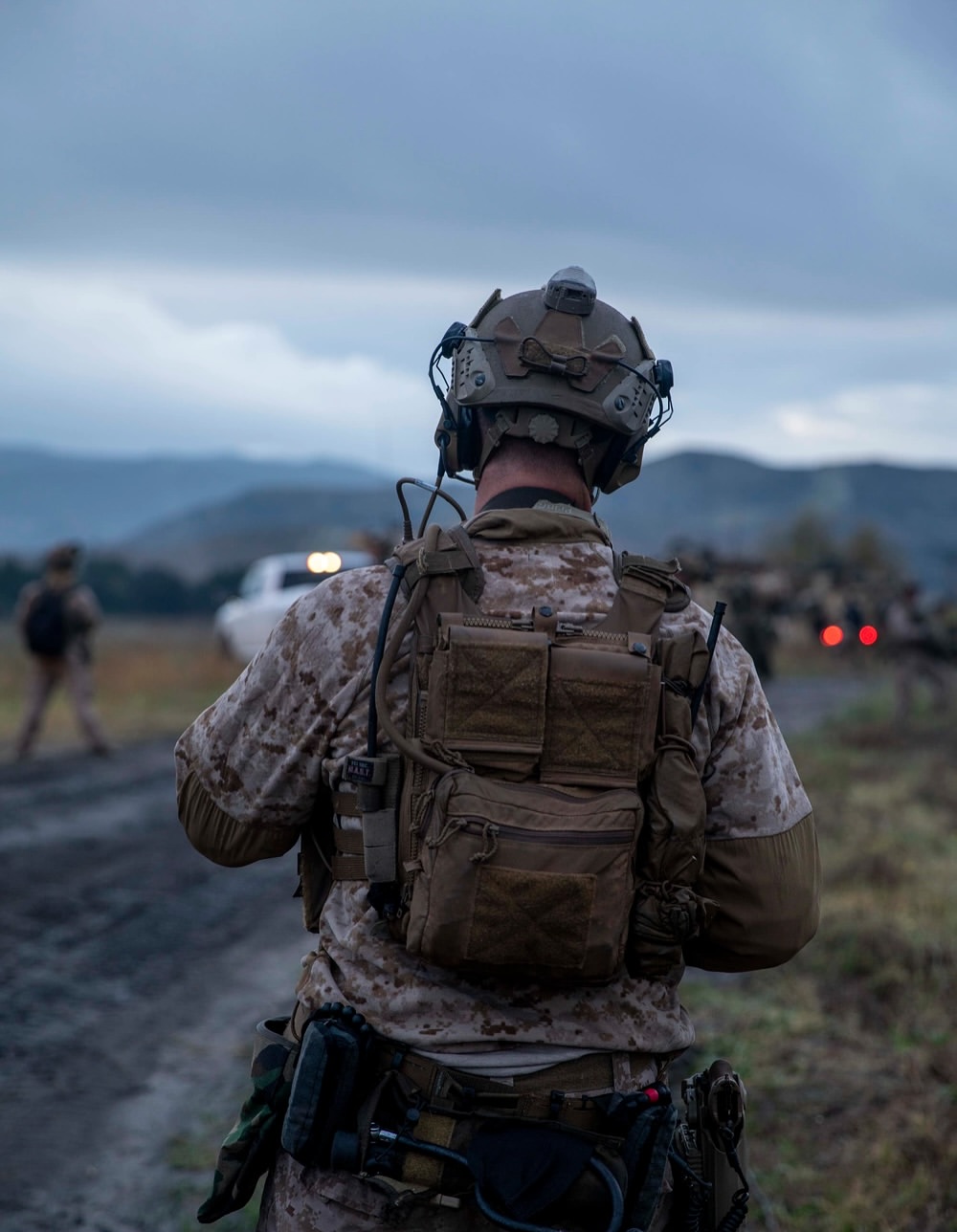 soldier outside around vehicles at a meetup point