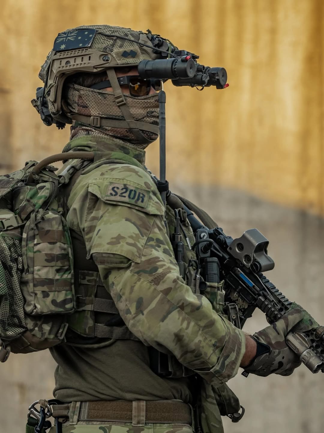 soldier standing and looking in gear with a gun
