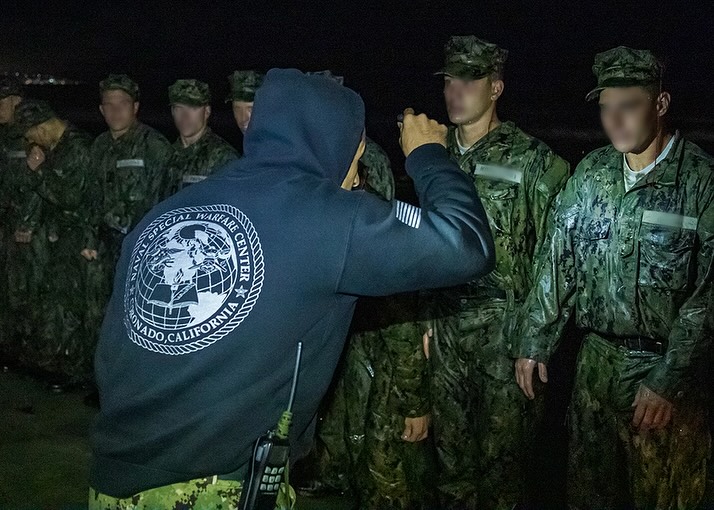 soldier performing unit PT at night