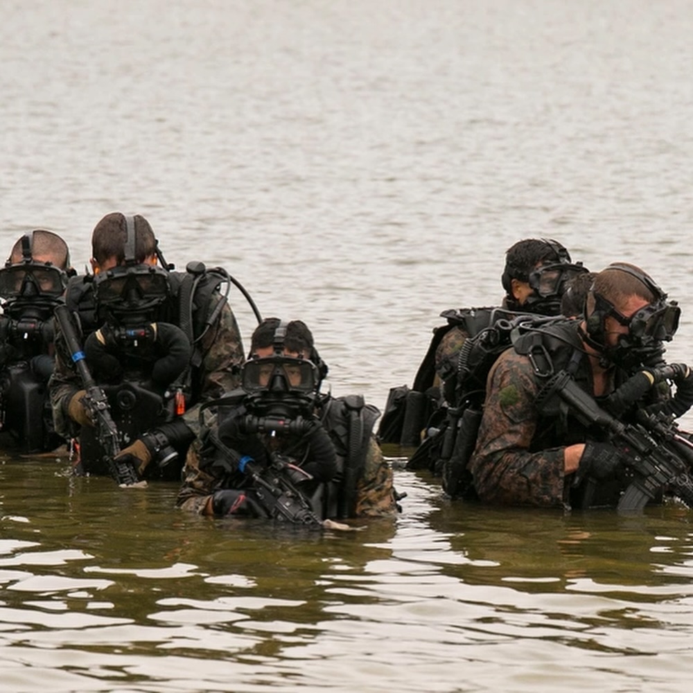 soldiers in diving gear coming out of the water