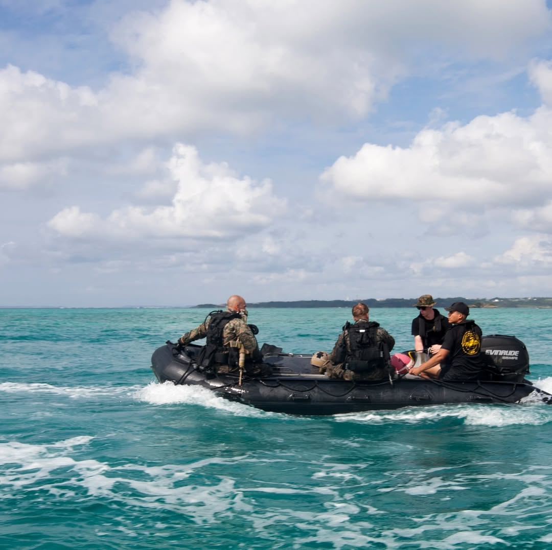 soldiers in a boat in the ocean