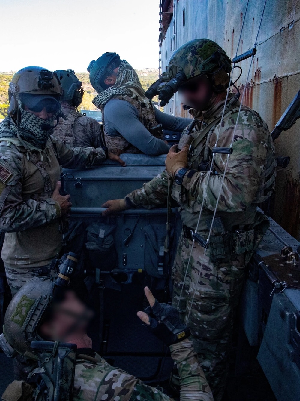 soldiers in gear working outside