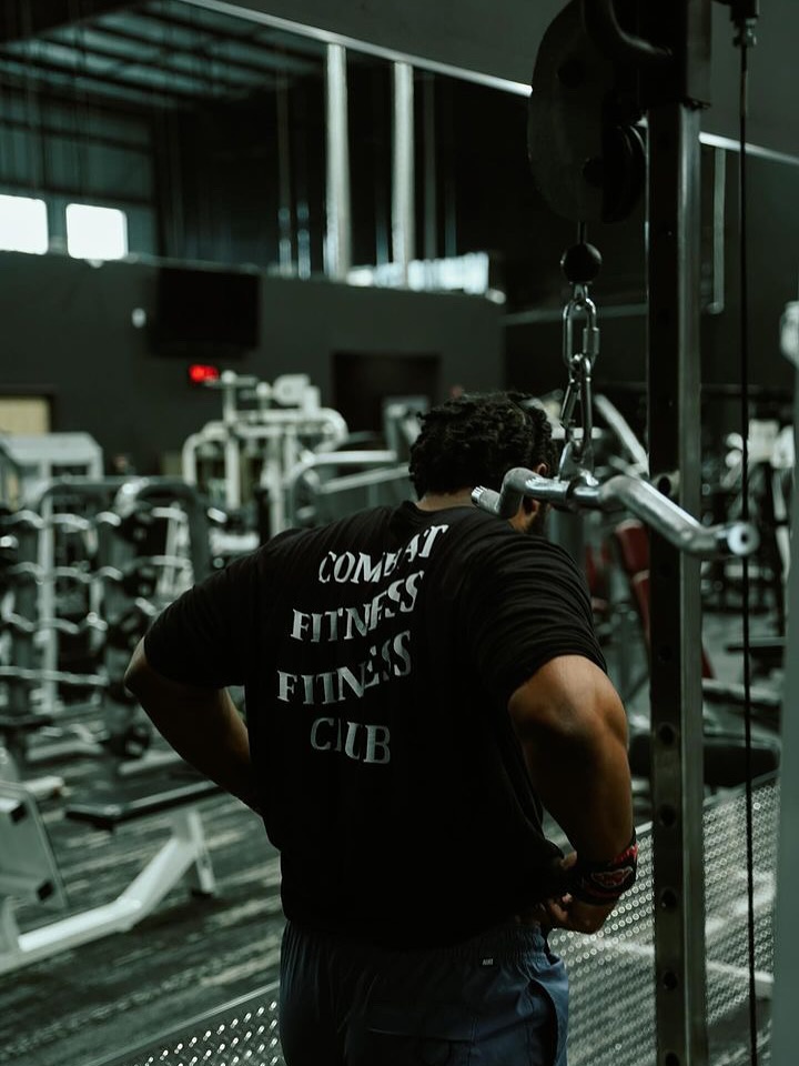 Combat Fitness Athlete lifting weights in the gym