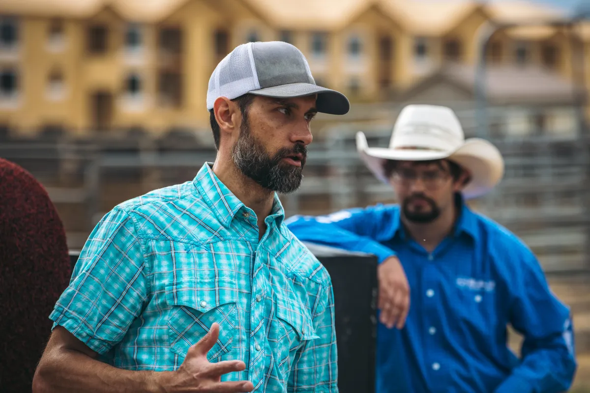 Wiley Petersen coaching bull riding students at a clinic