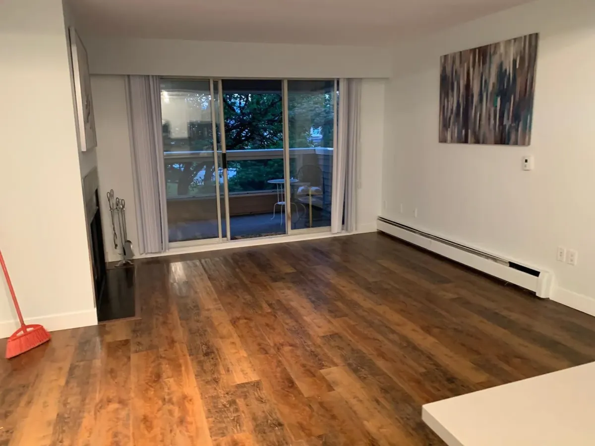 Vinyl plank flooring with rustic medium-brown wood grain installed in a living room