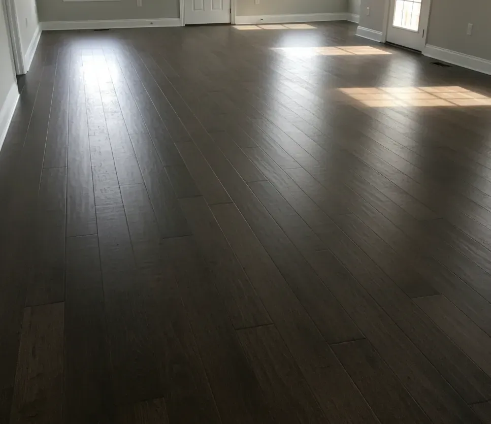 Luxury vinyl plank (LVP) flooring installed with dark matte wood-look finish – All Type Floors