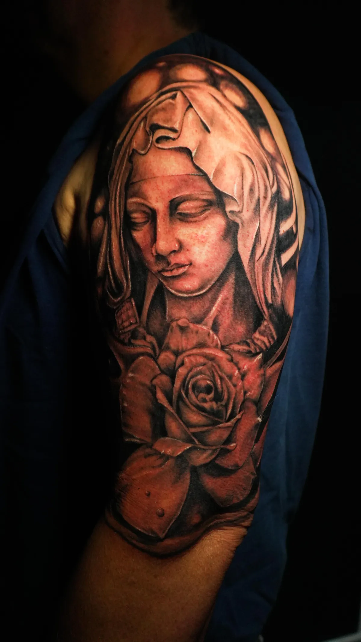 person with tattoo on right arm