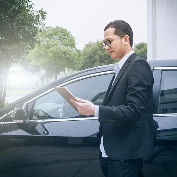 Man looking at auto insurance for a vehicle