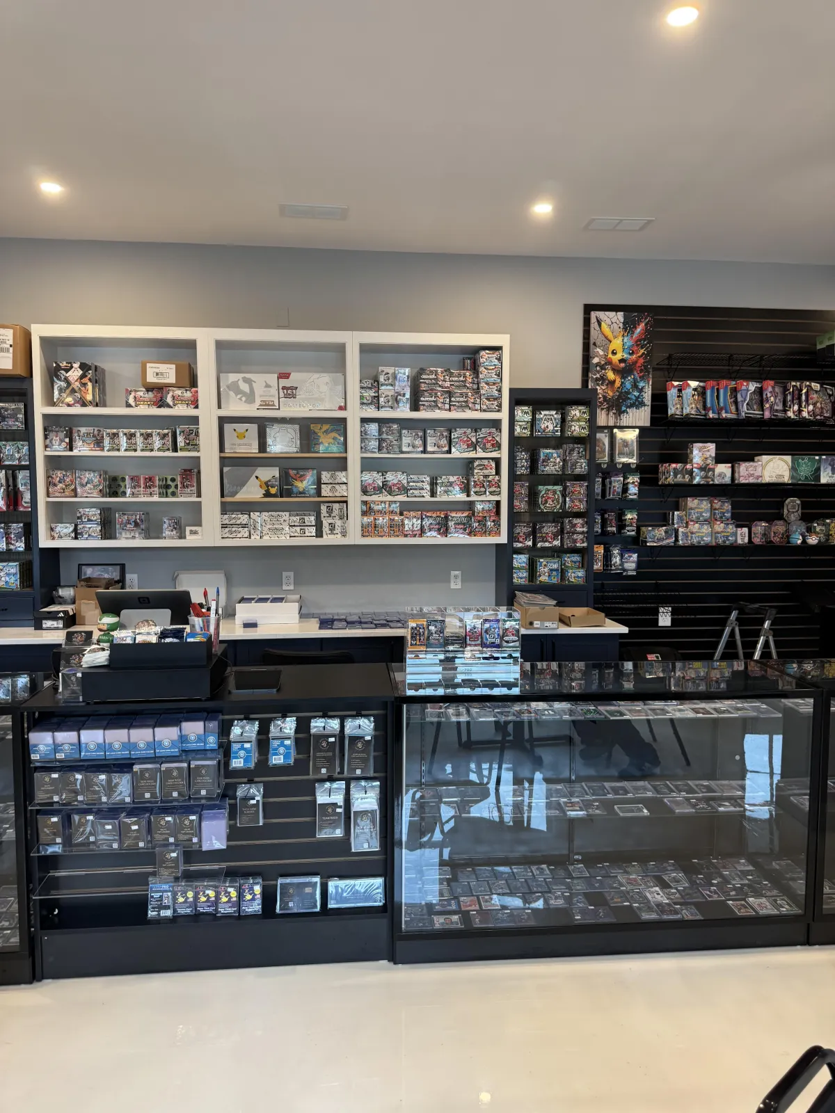 SeaDubs Card Shop interior with sports cards, Pokémon products, singles, slabs, and sealed boxes in Cape May Court House NJ