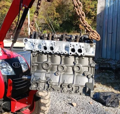 rebuilt 22re engine suspended by vehicle