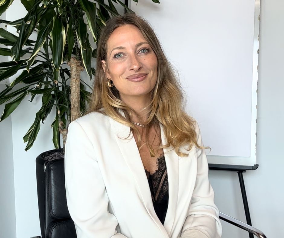 Integrative health coach Irene Fogale sitting calmly, representing stress management and balanced lifestyle coaching