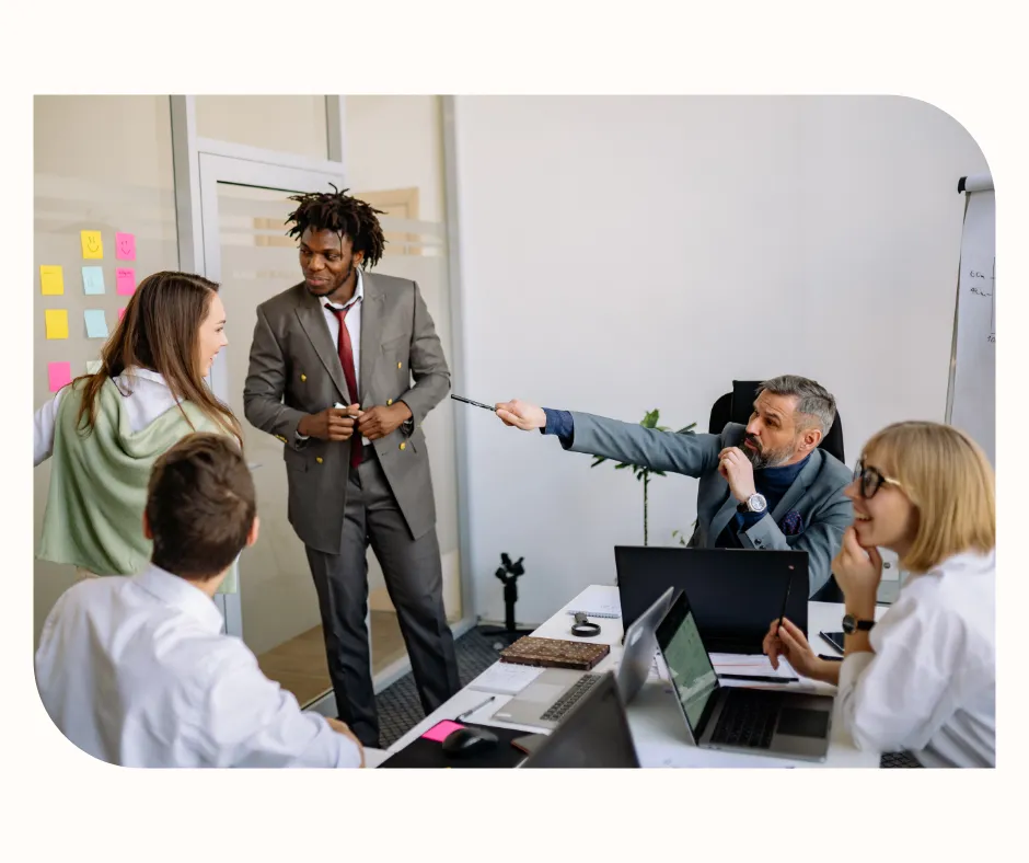Busy professionals in a workplace meeting, reflecting high-stress environments and modern work-life challenges