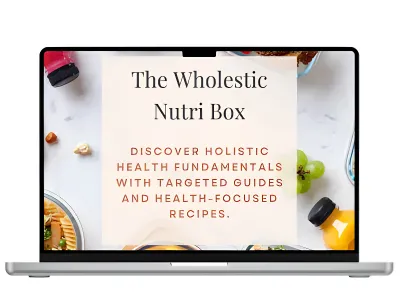 Laptop displaying “The Wholestic Nutri Box” over a plate of colorful whole foods including vegetables, fruits, and grains.