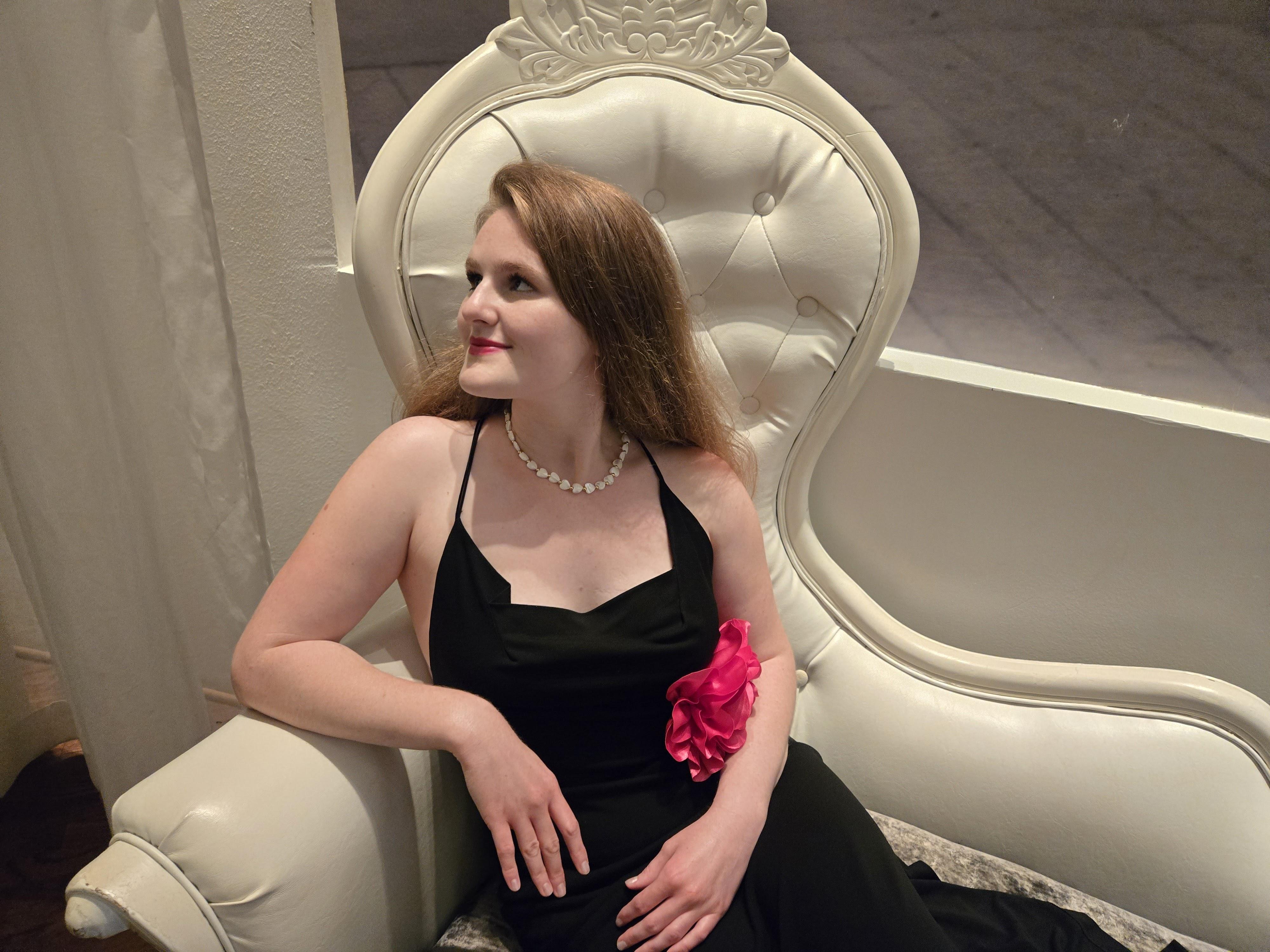 SharmaLia Jones, founder & owner of SharmaLia Jones Designs, seated portrait on the contact page