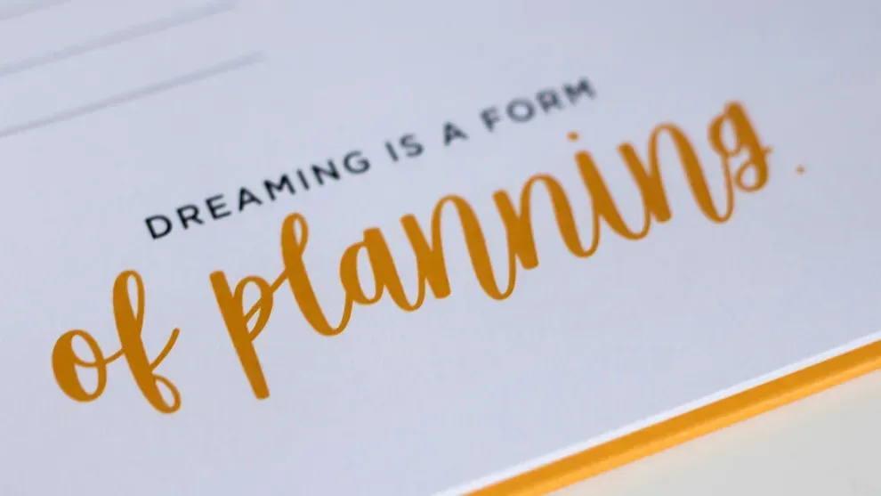 Quote card reading Dreaming is a form of planning, representing future financial planning