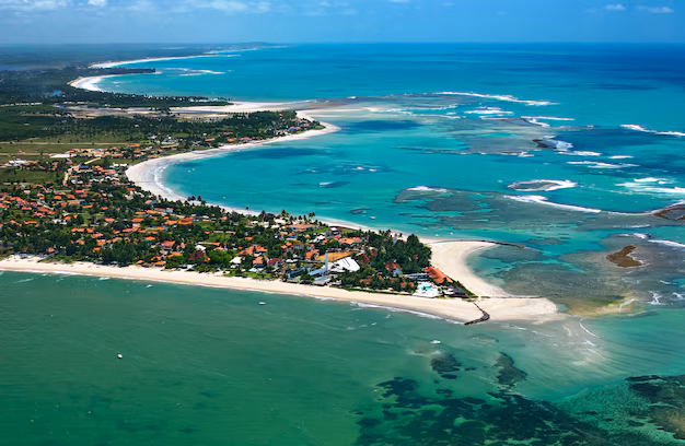 Modern glass building against older brick architecture