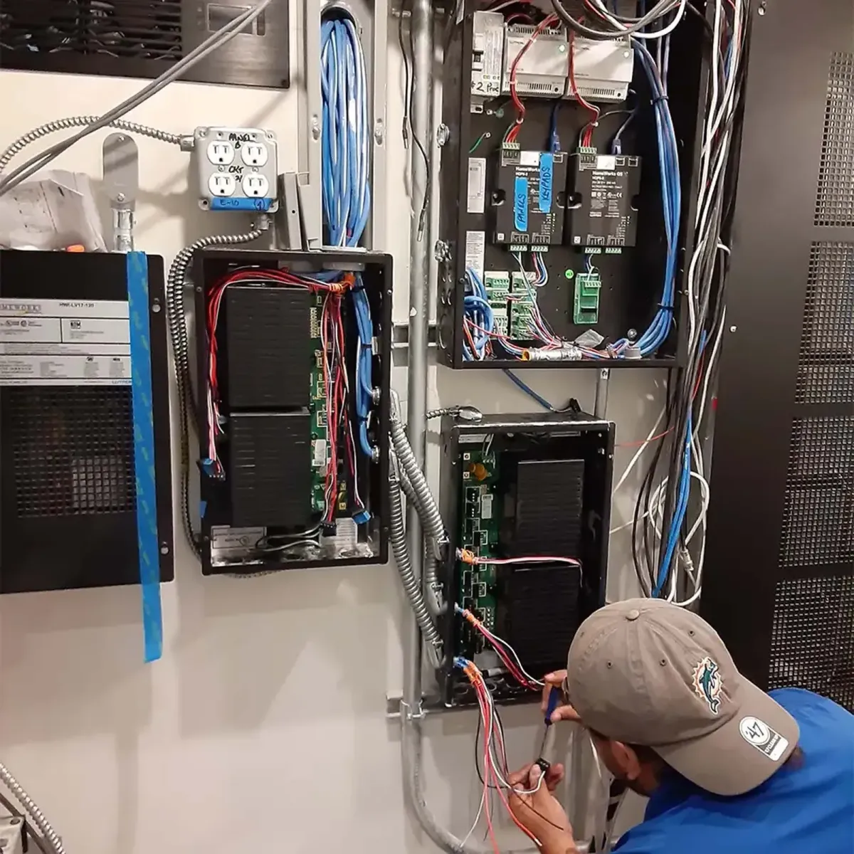 Residential electrician performing smart home electrical wiring and system installation in El Paso home by Caldwell Electrical Contractors