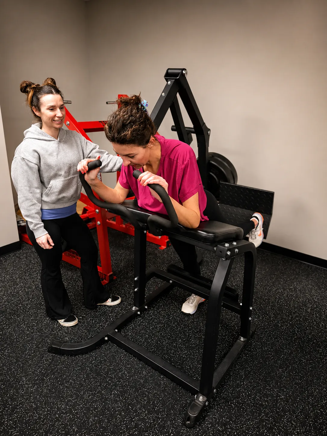 Personal trainer coaching client during one-on-one training session at 4Balance Fitness