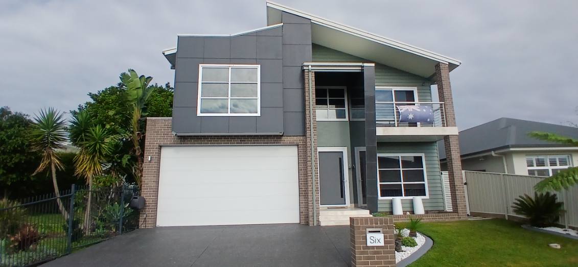 Completed driveway and exterior house painting