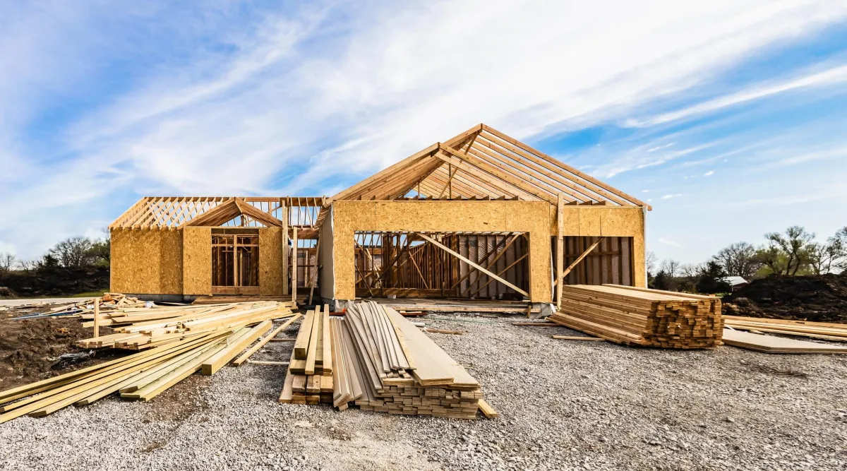 House under construction with framing in progress, showcasing VHrestoration's expertise in residential building and construction services.