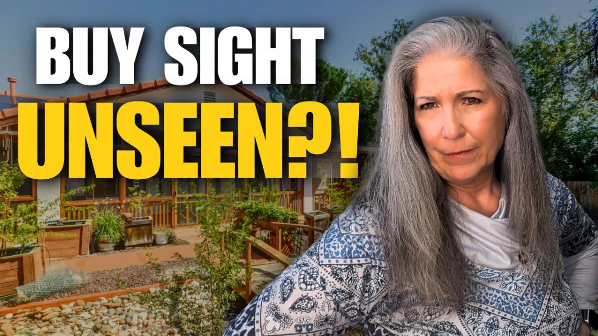 A YouTube-style thumbnail features a woman with long grey hair in the foreground, looking toward the camera with a skeptical or questioning expression. To her left, large bold text reads "BUY SIGHT" in white and "UNSEEN?!" in bright yellow. The background shows a suburban house with a tiled roof, a wooden porch, and several large wooden planter boxes filled with greenery in the front yard. The overall lighting is bright and sunny, typical of real estate or lifestyle content.