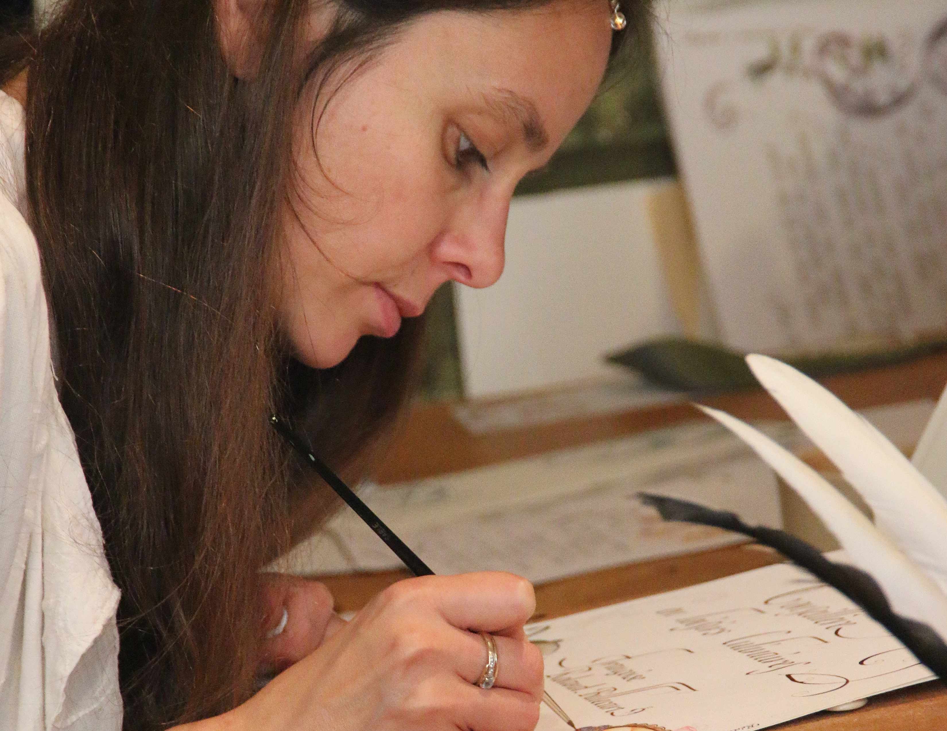 woman writing calligraphy