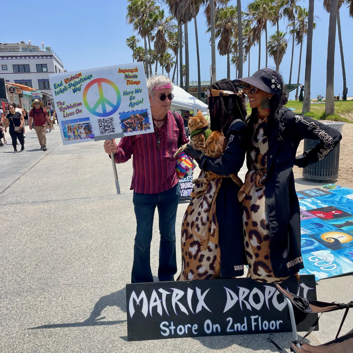 a room with a red wall with pictures on it
