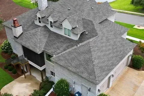 Aerial view of completed gray asphalt shingle roof on large residential home in Eden Prairie by Eden Prairie Roofing