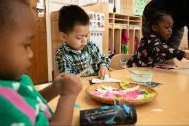 Girl follows directions during arts and crafts time.