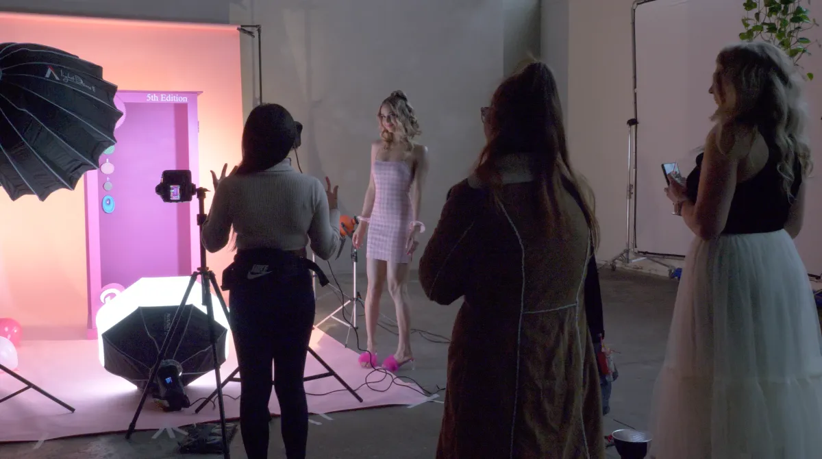 A young girl named Catherine Abe on a kitchen counter smiling 