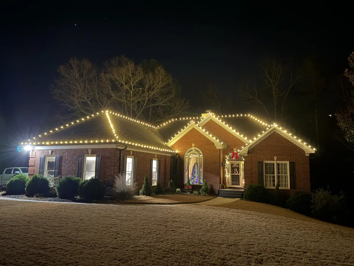 Warm white Christmas lights installed on a home in Athens Georgia