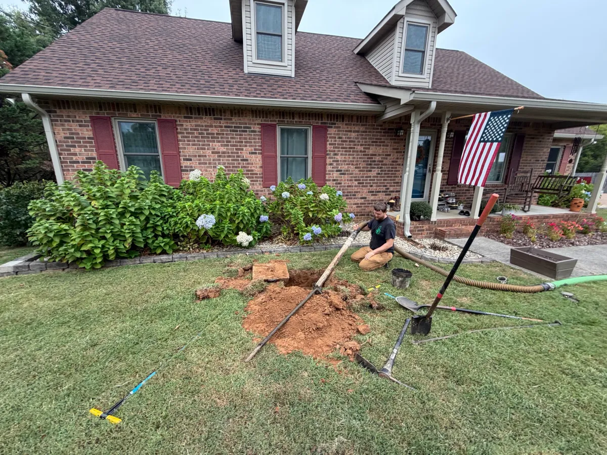 Shamrock Septic crew pumping a septic tank in the Murfreesboro area