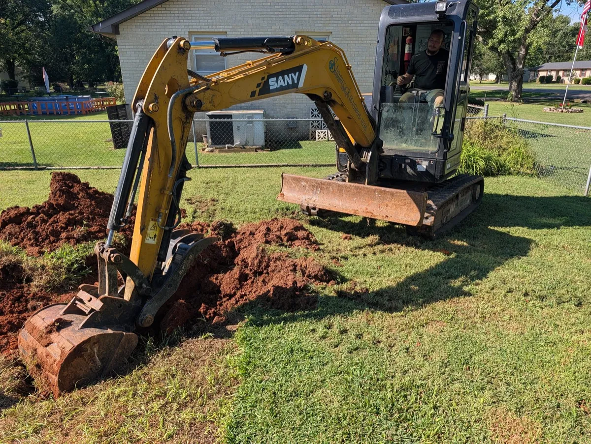 Shamrock Septic excavator on a septic job in Murfreesboro, TN