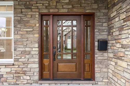 Professional installation of elegant front entry door with decorative glass by Pure Windows licensed contractors in Cincinnati, ensuring secure, stylish, and energy-efficient results
