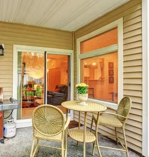 Modern sliding glass door installation by Pure Windows connecting a Cincinnati patio to the living area, offering seamless indoor-outdoor access, year-round comfort, and updated home style.