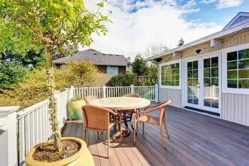 Modern patio door replacement by Pure Windows in Cincinnati, featuring durable materials, expert craftsmanship, and seamless connection to a backyard deck.