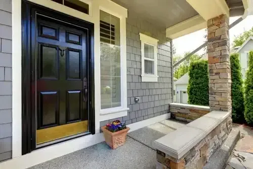 Modern black entry door with gold accent installed by Pure Windows in a Cincinnati home, enhancing curb appeal, comfort, value, and security for year-round performance.