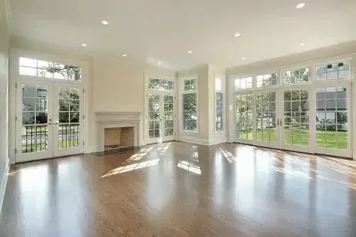 Sunlit Cincinnati living room featuring floor-to-ceiling replacement windows installed by Pure Windows contractors, showcasing modern design and energy efficiency