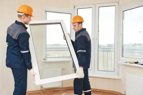 Professional Pure Windows contractors in safety gear installing a new window during a step-by-step Cincinnati home upgrade, ensuring quick and efficient service