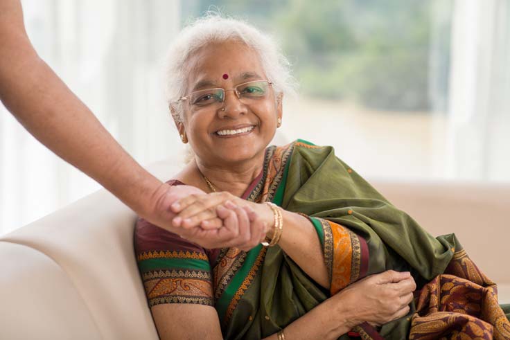 Patient experiencing relief from chronic pain during a hands-on physiotherapy session