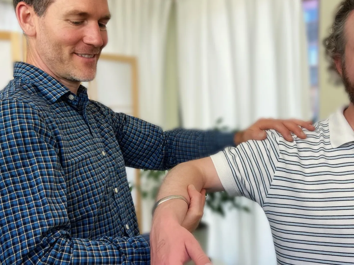 Jared doing range of motion of a shoulder