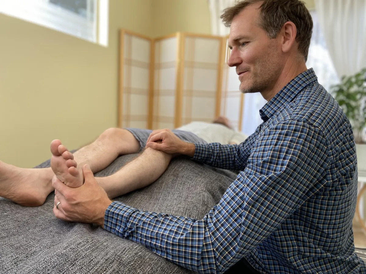 Jared treating the knee and ankle