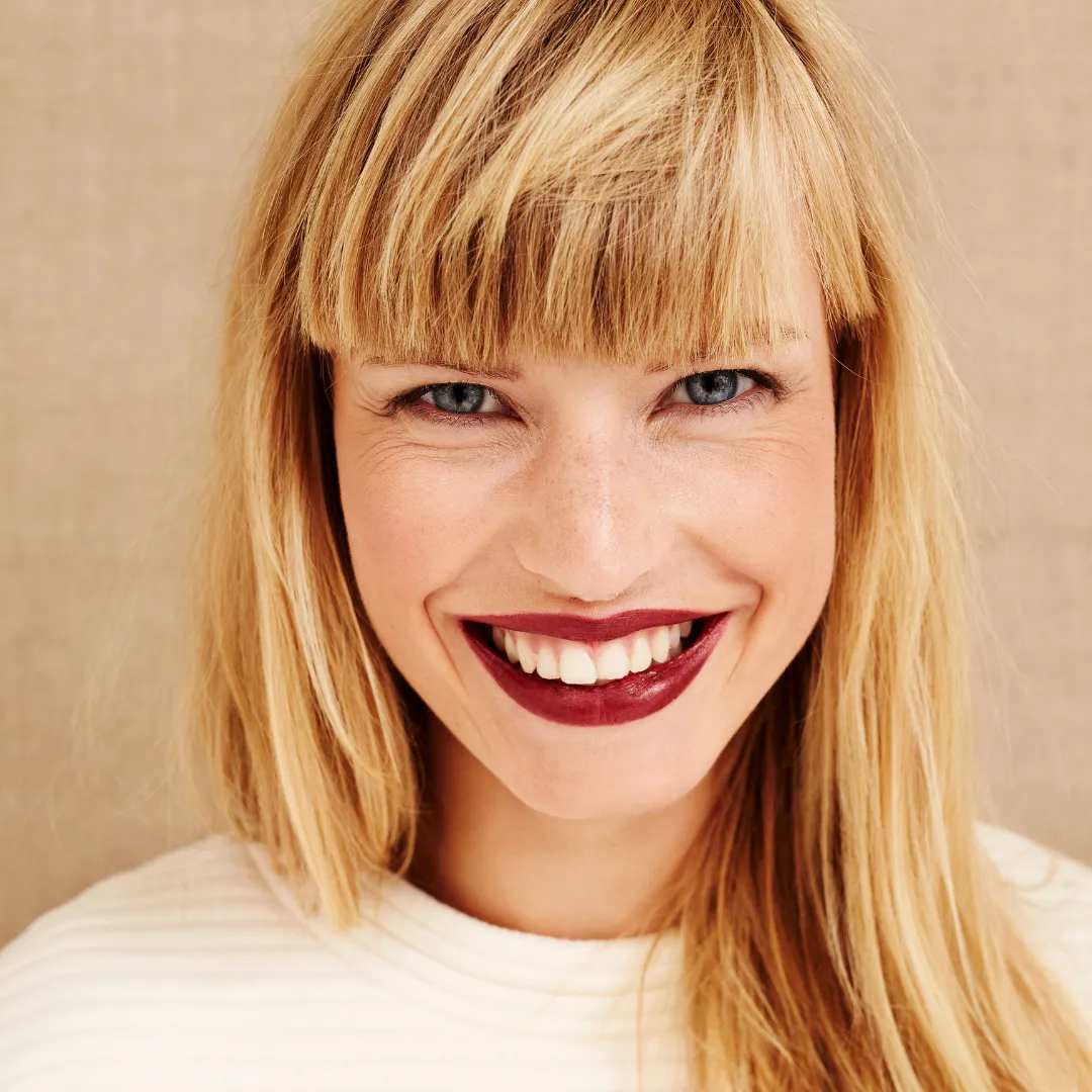 Smiling Woman with Red Lipstick and Blonde Hair