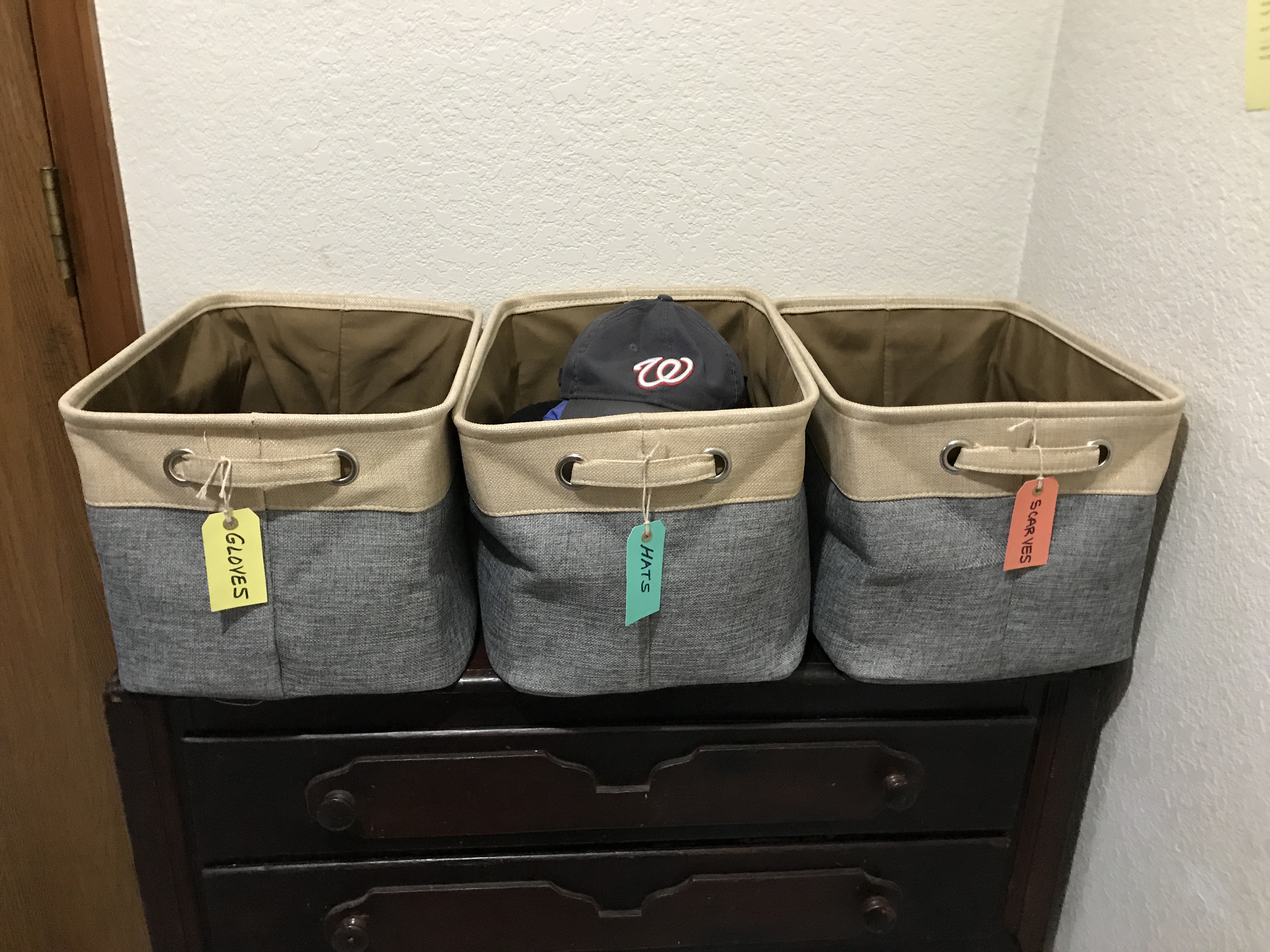 3-storage-bins-with-tags-by-front-door