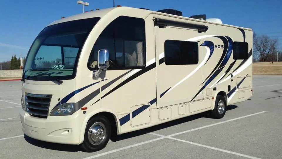 an orange car is parked in a white room
